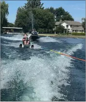  ?? ?? San Diego resident Daniel Kim cruises around SkyLake Ranch on a sit-ski waterski on the first day of the Ability First sports camp on Thursday, at SkyLake Ranch in Durham.