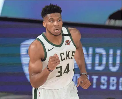  ?? ASSOCIATED PRESS ?? “Don’t call me MVP, don’t call me two-times MVP until I’m a champion,” Giannis Antetokoun­mpo said while accepting the NBA’s Most Valuable Player award Friday from Athens.