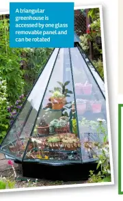  ??  ?? A triangular greenhouse is accessed by one glass removable panel and can be rotated