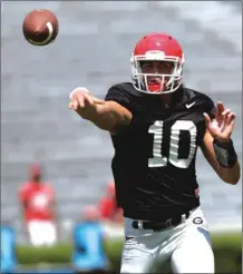  ?? JOHN ROARK / The Associated Press ?? Georgia quarterbac­k Jacob Eason makes a throw during the Bulldogs’ open practice on Aug. 6.