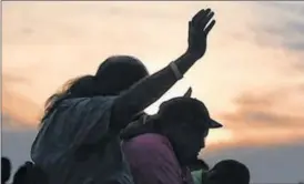  ?? BROOKE LAVALLEY PHOTOS / THE COLUMBUS DISPATCH ?? Steve Wilson, a recovering alcoholic for two years, raises his arms during the Hope Over Heroin sermon.