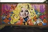  ??  ?? A mural of Dolly Parton, outside The 5 Spot, a music club in Nashville, has become a new tourist attraction and hot spot for selfies.