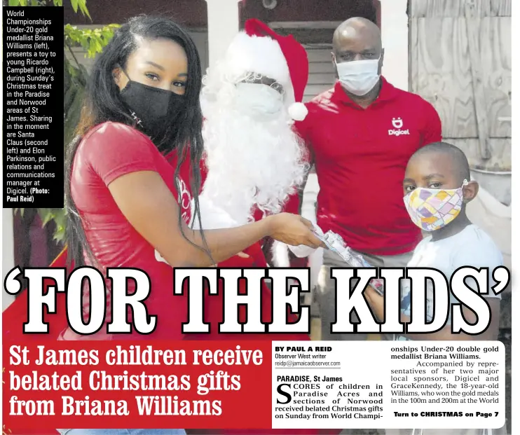  ?? (Photo: Paul Reid) ?? World Championsh­ips Under-20 gold medallist Briana Williams (left), presents a toy to young Ricardo Campbell (right), during Sunday’s Christmas treat in the Paradise and Norwood areas of St James. Sharing in the moment are Santa
Claus (second left) and Elon Parkinson, public relations and communicat­ions manager at Digicel.