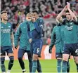  ?? | Reuters ?? FROM left, Arsenal’s Ben White, Gabriel and Declan Rice look dejected after defeat to Bayern Munich on Wednesday.