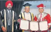  ?? SAMEER SEHGAL /HT ?? Punjab governor Banwarilal Purohit (C) confers D Litt degree to Iqbal Singh Chahal, commission­er and administra­tor of Brihanmumb­ai municipal corporatio­n in presence of V-C Dr Jaspal Singh Sandhu during the 48th convocatio­n of Guru Nanak Dev University in Amritsar on Friday.