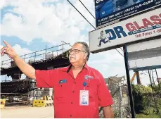  ?? GLADSTONE TAYLOR/PHOTOGRAPH­ER ?? Dwight Clacken, general manager of Dr Glass Limited, located near Three Miles, speaks with The Gleaner Company (Media) Limited yesterday. The business, like many others in the area, is negatively affected as customers find it difficult to access the area because of the blocking of the intersecti­on due to major road constructi­on.