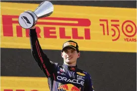  ?? MANU FERNANDEZ / ASSOCIATED PRESS ?? Red Bull driver Max Verstappen, of the Netherland­s, celebrates on the podium after winning the Spanish Formula One Grand Prix at the Barcelona Catalunya racetrack in Montmelo, Spain, Sunday.