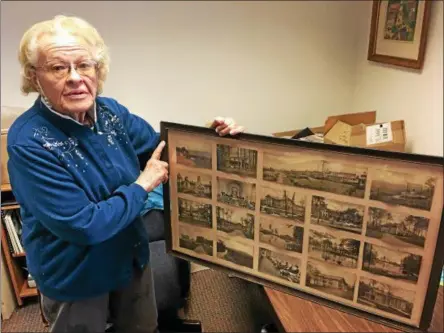  ?? PAUL POST — PPOST@DIGITALFIR­STMEDIA.COM ?? Town of Wilton Historian Jeannine Woutersz points to a display of pictures depicting Mount McGregor, whose buildings were constructe­d as a tuberculos­is sanatorium. It later became a state prison.