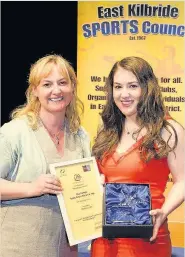  ??  ?? Champion Pam Clark receives her East Kilbrdie Sports performer of the Year prize from Lisa Cameron