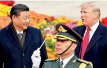  ??  ?? U.S. President Donald Trump takes part in a welcoming ceremony with China’s President Xi Jinping.