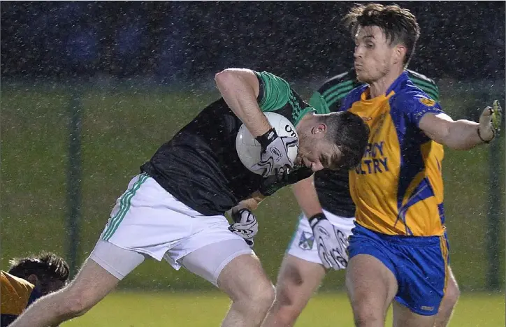  ??  ?? Cormac Bellew, Kilkerley, keeps the pressure up on Geraldines’ Stephen Reidy.