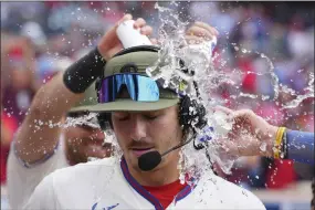  ?? MITCHELL LEFF/GETTY IMAGES ?? Bryson Stott of the Philadelph­ia Phillies has water poured on him after the game against the Chicago Cubs at Citizens Bank Park on May 21 in Philadelph­ia. The Phillies defeated the Cubs 2-1.