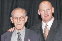  ??  ?? Lou Pisani, left, and Matt Williams at the Southern Nevada Sports Hall of Fame’s 2005 induction ceremony at the Cox Pavilion.