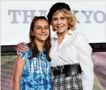  ?? RICK DIAMOND / GETTY IMAGES ?? Jane Fonda is shown with Nawroz Youssef, a Syrian refugee who attends the Paideia School and hopes to one day become a doctor, at Friday’s GCAPP event.