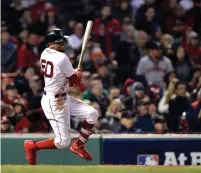  ?? (Bob DeChiara-USA TODAY Sports) ?? BOSTON RED SOX right fielder Mookie Betts hits an RBI double in the eighth inning on Sunday night.