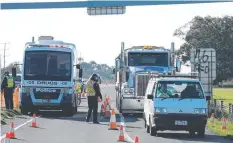  ?? Picture: PETER RISTEVSKI ?? SAFETY FIRST: Police man a checkpoint at the Little River exit on the Princes Freeway on Thursday.