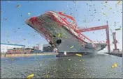  ?? REUTERS ?? China's first domestical­ly built aircraft carrier during its launching ceremony in Dalian, Liaoning province on Wednesday.