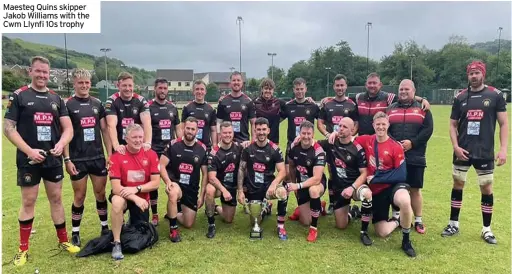  ??  ?? Maesteg Quins skipper Jakob Williams with the Cwm Llynfi 10s trophy