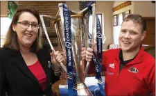  ??  ?? President Mamie Quirke and captain Charlie Louth with the Champions Cup at the reception in Arklow Rugby Club.