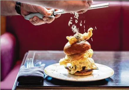  ?? CONTRIBUTE­D BY HENRI HOLLIS ?? Bar Margot’s SuperBalle­r Burger is a half-pound Wagyu burger topped with lobster, bacon and black truffle-foie gras aoili.