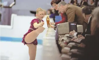  ?? AP FILE PHOTO ?? BOO HOO: Tonya Harding cries as she shows the judges the lace problem with her skate during her free skate program in the 1994 Winter Olympics in Norway.