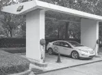  ?? Qilai Shen/Bloomberg ?? A Chevrolet Volt electric vehicle sits parked at a charging station at the General Motors China headquarte­rs in Shanghai.