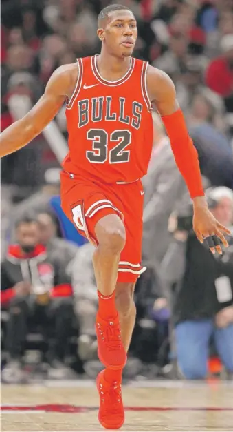  ?? GETTY IMAGES ?? Kris Dunn later realized that leaping onto the scorer’s table in the preseason was not a great idea.