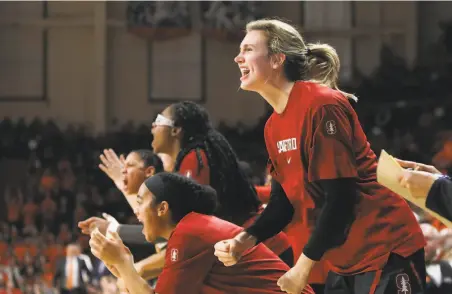  ?? Amanda Loman / Associated Press ?? The Stanford bench had reason to celebrate as the thirdranke­d Cardinal overcame eighthrank­ed Oregon State.