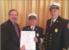  ?? Submitted photo ?? State Rep. Kevin J. Kuros of Uxbridge presents Uxbridge Deputy Fire Chief Steve Tancrell with a proclamati­on from the state in recognitio­n of the award Tancrell recieved at the Massachuse­tts Executive Office of Public Safety and Security’s 28th annual...