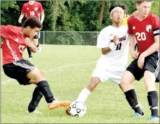  ?? RICK PECK/MCDONALD COUNTY PRESS ?? McDonald County’s Eh Doh Say collides with Collin Farquhar (20) of New Covenant Academy while fighting for control of the ball with Emmett Reid (13) of the Warriors. New Covenant claimed a 3-0 in the opening game of the Cassville High School Soccer...