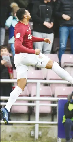  ??  ?? FAST START: Northampto­n forward Vadaine Oliver jumps for joy