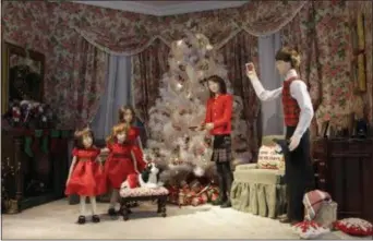  ?? MARK LENNIHAN — THE ASSOCIATED PRESS, FILE ?? In a November 2010 photo, a store window Christmas scene is part of the holiday display at the Lord &amp; Taylor flagship store in New York.
