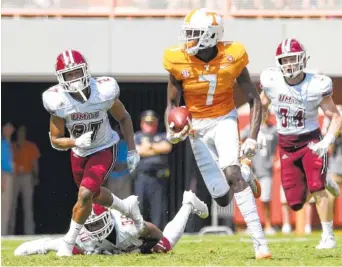  ?? STAFF PHOTO BY ROBIN RUDD/ TIMES FREE PRESS ?? Tennessee receiver Brandon Johnson, center, made seven catches for 123 yards, both career highs, in the Vols’ 17-13 defeat of UMass on Saturday in Knoxville. Injuries have forced Johnson to line up in the slot rather than out wide early this season.