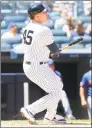  ?? Mike Stobe / Getty Images ?? The Yankees’ Luke Voit hits a three-run home run in the fourth inning against the Mets Tuesday.