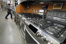  ?? STEVEN SENNE — THE ASSOCIATED PRESS ?? Stoves on display at a Home Depot in Boston. The Commerce Department reported Wednesday that orders for durable goods declined last month for the first time after nine consecutiv­e monthly gains including a sizable 3.5% rise in January.