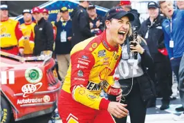  ?? Associated Press ?? Joey Logano reacts in Victory Lane after winning a NASCAR Cup Series auto race Sunday at Darlington Raceway in Darlington, S.C.