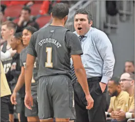  ?? TECH AT NORTH CAROLINA STATE USA Today Sports - Jamie Rhodes ?? Georgia Tech coach Josh Pastner talks with Kyle Sturdivant during the Yellow Jackets’ loss to Louisville on Wednesday.