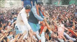  ?? PTI PHOTO ?? BJP general secretary Ram Madhav and the party’s Tripura unit chief, Biplab Deb, the frontrunne­r for the CM’s post, greet supporters in Agartala on Saturday after winning the state election.