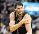  ?? BOB DECHIARA/ USA TODAY ?? Cleveland Cavaliers forward Kevin Love grabs his left shoulder after tangling with the Boston Celtics’ Kelly Olynyk on Sunday.