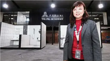  ??  ?? Giving back: The academy aims to equip the less privileged group with profession­al tiling skills, says Lim.