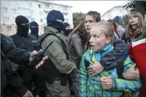  ?? TheAssocia­tedPress ?? A woman shouts in front of police during a rally in support of Maria Kolesnikov­a in Minsk, Belarus, Tuesday.