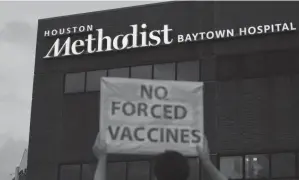  ?? YI-CHIN LEE/HOUSTON CHRONICLE VIA AP ?? A sign is displayed June 7 at Houston Methodist Hospital in Baytown, Texas, to protest a policy that says hospital employees must get vaccinated against COVID-19 or lose their jobs.