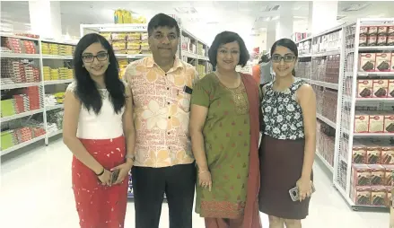  ?? Photo: Selita Bolanavanu­a. ?? Charan Jeath Singh and his wife Dr Swaran Singh with his two daughters, Namrata Singh (left) and Mandri Singh (right) inside their new CJS supermarke­t at their Nabua Complex yesterday.