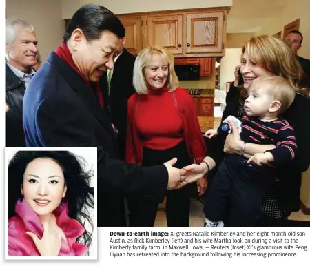  ??  ?? Down-to-earth image: Xi greets Natalie Kimberley and her eight-month-old son Austin, as Rick Kimberley (left) and his wife Martha look on during a visit to the Kimberly family farm, in Maxwell, Iowa. — Reuters (Inset) Xi’s glamorous wife Peng Liyuan...