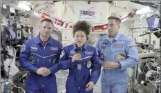  ?? NASA video image via AP ?? U.S. astronaut Jessica Meir speaks, accompanie­d by Andrew Morgan and Chris Cassidy, during a news conference held by the American members of the Internatio­nal Space Station on Friday.