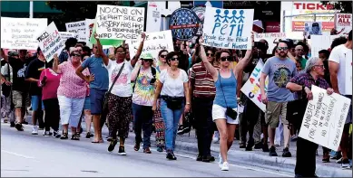  ?? TRIBUNE NEWS SERVICE ?? Protest groups rallied along downtown Miami streets against the immigratio­n policies of President Donald Trump.