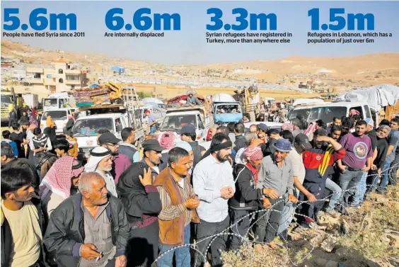  ?? Photo / AP ?? Syrian refugees gather at the Lebanese town of Arsal as they prepare to return over the border to Syria.