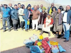  ?? Picture: SUPPLIED ?? SPIRIT OF MANDELA: Officials from Enoch Mgijima Local Municipali­ty and the department of human settlement­s visit a family in Tarkastad whose house was destroyed by severe storms. CB Services is rebuilding their house free of charge