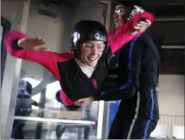  ?? NHAT V. MEYER — STAFF PHOTOGRAPH­ER ?? An instructor helps an indoor skydiving first-timer take to the air in the flight chamber at Union City’s iFLY. It’s the type of adrenaline rush that could be an exhilarati­ng date.