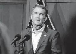  ?? BOB BROWN/ASSOCIATED PRESS FILE ?? Gov. Ralph Northam speaks to reporters in September. Northam, who announced 11 days ago that he has the coronaviru­s, is criticizin­g Donald Trump’s downplayin­g of it.